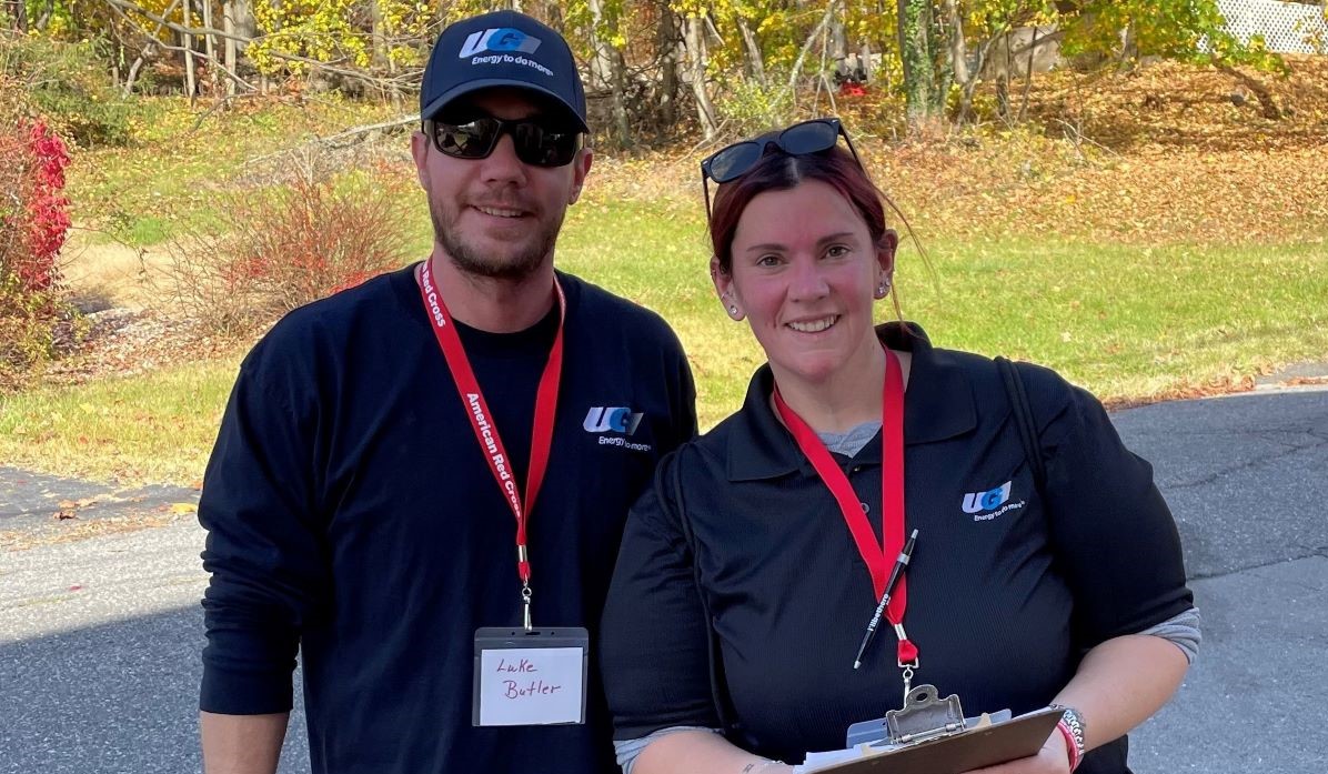 Two UGI employees smile for photo while volunteering with American Red Cross.