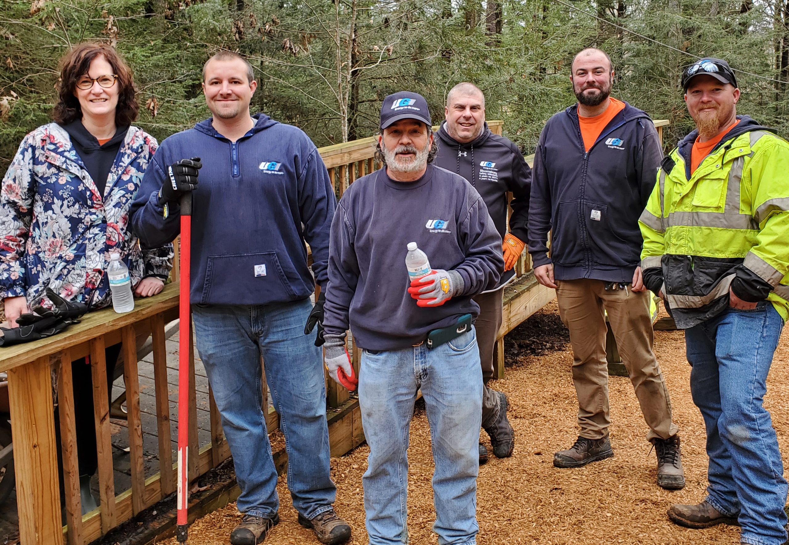 UGI employees posing for picture while doing outdoor work